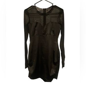 Black mesh sleeve and black silk mini dress.